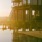 swimming pool with the sunset beaming across the water
