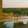 swimming pool with lounge chairs and a view of a city