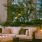 couch on an outdoor patio with a fireplace