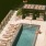 aerial view of a woman relaxing at a pool with lounge chairs
