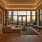 social room with large windows and seating area