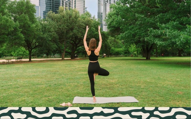 a person doing yoga in a park