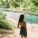 a girl standing in front of a water area