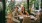 a man and woman sitting at a table with food